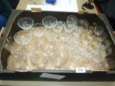 A quantity of glasses, tumblers with fern design, wine, sherry, champagne glasses, etc.