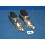 A pair of Victorian Pewter Shoe pin cushions.