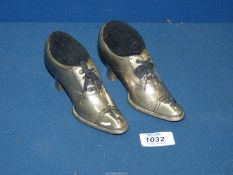A pair of Victorian Pewter Shoe pin cushions.