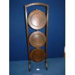 A Mahogany metamorphic/folding three tier cake stand.