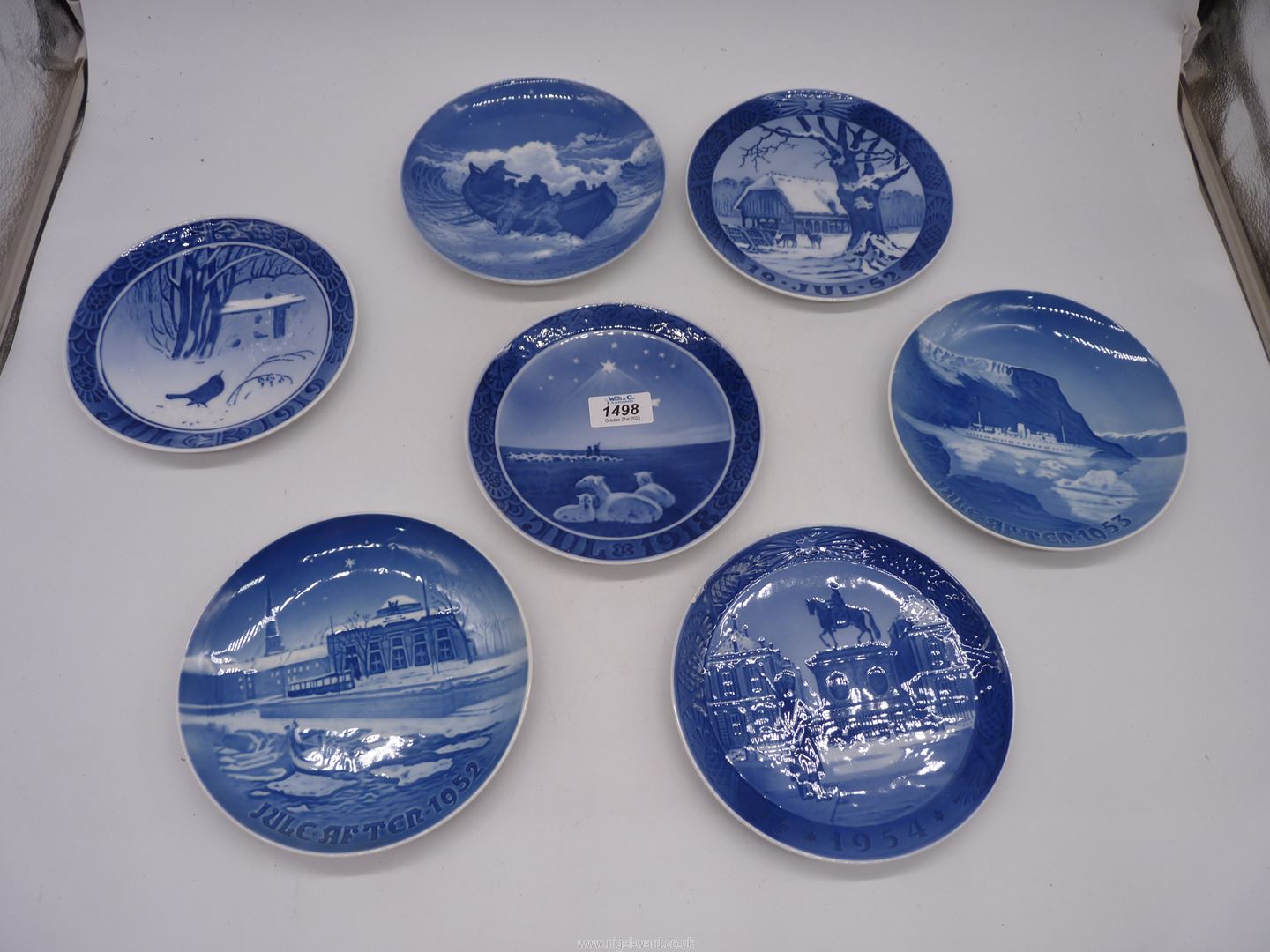 Four Royal Copenhagen Christmas plates and three Bing & Grondahl.