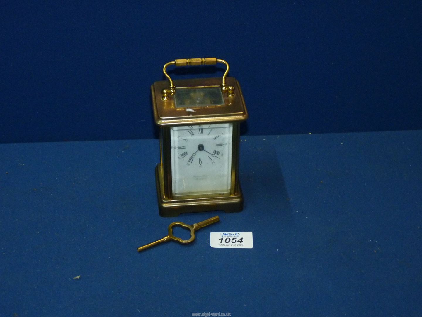 A Brass Carriage Clock by Bornand-freres Montbeliard, with key.