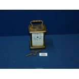 A Brass Carriage Clock by Bornand-freres Montbeliard, with key.