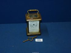 A Brass Carriage Clock by Bornand-freres Montbeliard, with key.