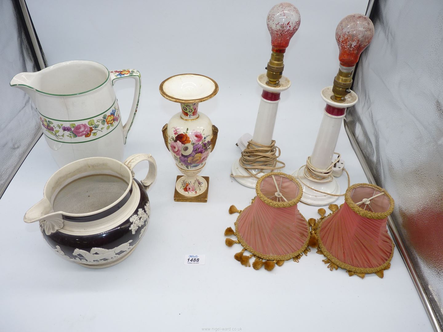 A quantity of china including a pair of white lamp bases with red collars and pink pleated shades,