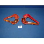 Two antique cased briar Pipes with hallmarked silver mounts and amber stems.