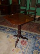 A 19th century Mahogany snap-top occasional table having a rectangular top with curved corners,