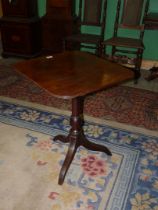 A 19th century Mahogany snap-top occasional table having a rectangular top with curved corners,