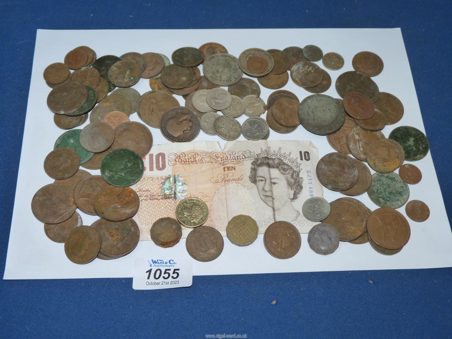 A quantity of English coins including a ten shilling note, including old pennies, half pennies,