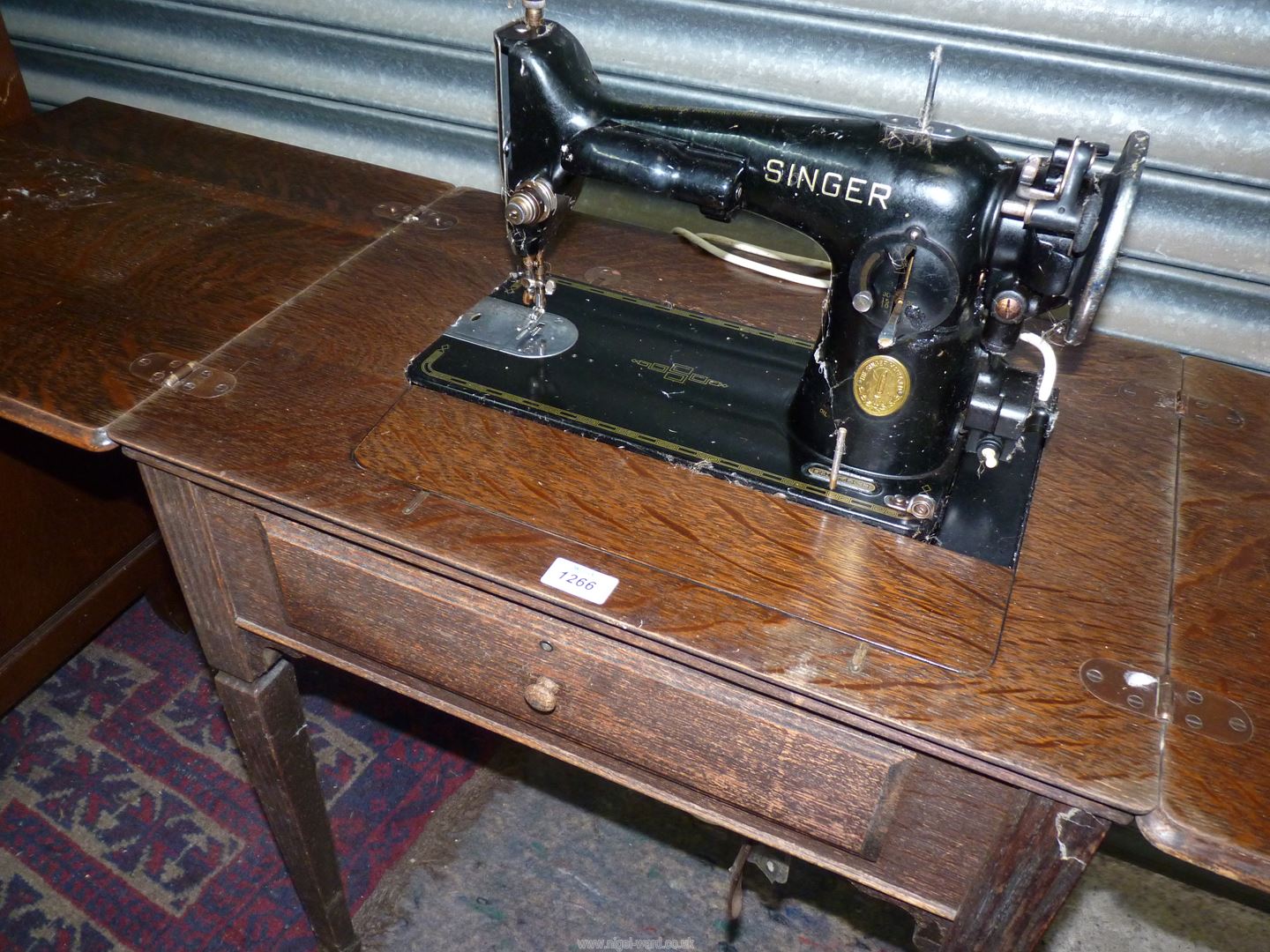 An Oak table contained Metamorphic Singer electric sewing machine folding down to form a table when - Image 7 of 7