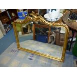 A large ornate gilt framed, bevel plated over-mantel Mirror, 50" wide x 40" high.