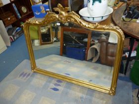 A large ornate gilt framed, bevel plated over-mantel Mirror, 50" wide x 40" high.