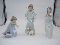 Three Nao figures: Girl telling puppy off, 10 1/2" (boxed), Girl with rag doll, 9 1/3",