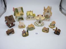 A box of china houses including Thimble Cottage and Petticoat Cottage by Lilliput Lane and The