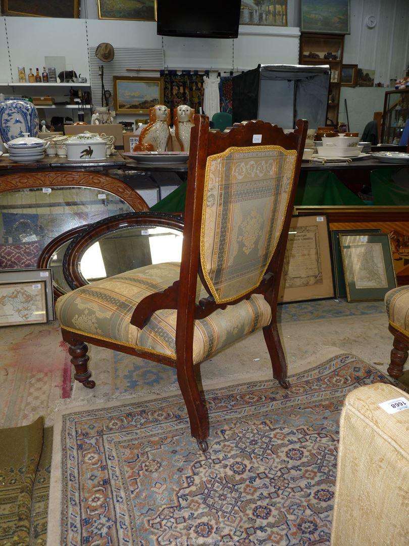 An Edwardian Mahogany framed lady's fireside chair standing on turned front legs and similarly - Image 2 of 2