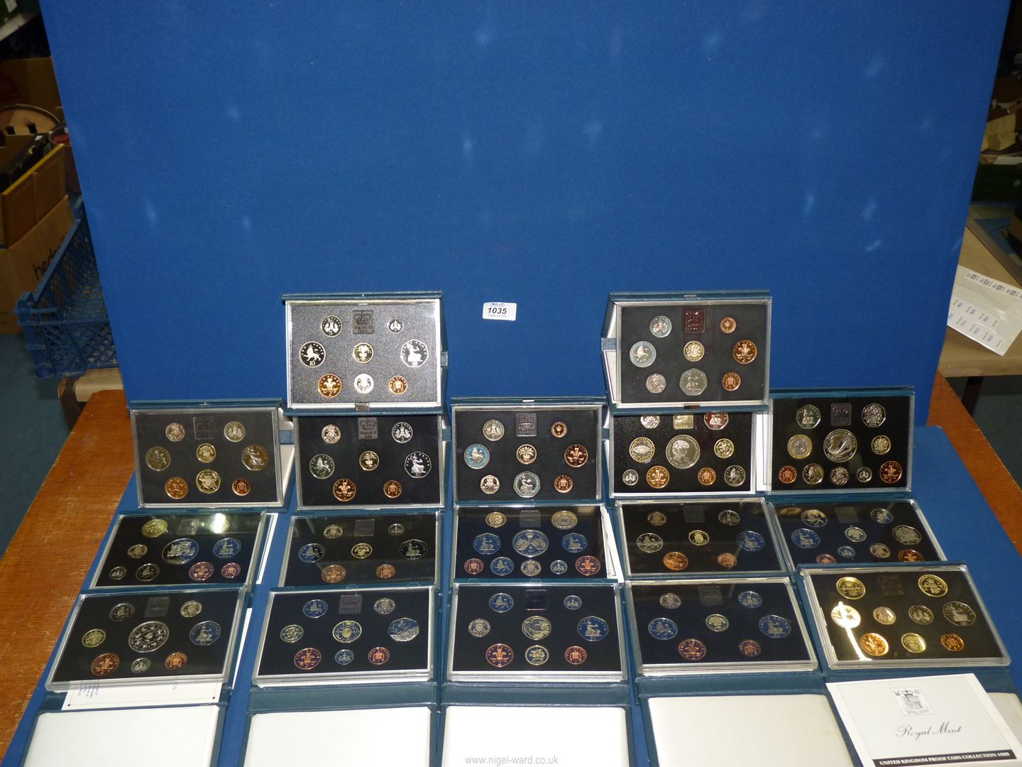 A quantity of 1983-1999 UK Proof coins in cases and sleeves packed in blue leatherette boxes (17). - Image 2 of 2