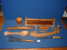 A quantity of kitchenalia including a rolling pin, a hand whisk, novelty bottle stoppers,