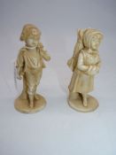 A pair of Royal Rydolstadt 19th century figures of children carrying wood in winter in a light salt