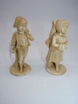 A pair of Royal Rydolstadt 19th century figures of children carrying wood in winter in a light salt