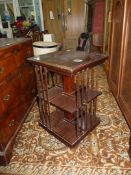 A Mahogany floor-standing revolving bookcase, 19" x 19" x 31" high approx.