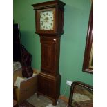 An Oak and Mahogany cased longcase / grandfather clock having light and dark-wood stringing,