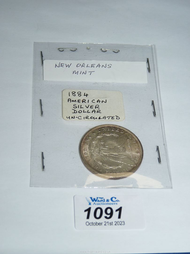 An American silver dollar dated 1884 from The New Orleans Mint.