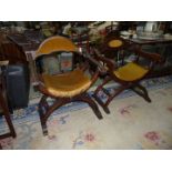 A Pair of dark-wood "X" legged arm-chairs having turned stretchers and with gold velvet/Dralon type