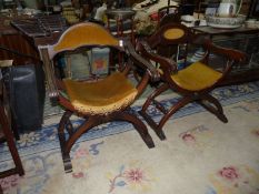 A Pair of dark-wood "X" legged arm-chairs having turned stretchers and with gold velvet/Dralon type