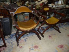 A Pair of dark-wood "X" legged arm-chairs having turned stretchers and with gold velvet/Dralon type