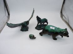 Four models of Eagle, Bear, Wolf, Elephant in dark to light green, one marked BMP to the base.