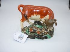 A circa 1820 Staffordshire 'Bull Baiting' group depicting brown,