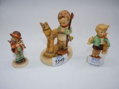 Three Goebel figures to include; boy with pull along horse,