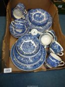 A quantity of blue and white china dinnerware including Wedgwood 'Avon Cottage' and Broadhurst