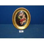 A gilt framed hand-painted porcelain plaque of Madonna Della Segiola 8" x 6 1/2" including frame,