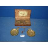 A W&T Avery brass Scale and weights, in original wooden box.