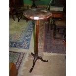 A Mahogany jardiniere stand on tripod feet, 43" tall.