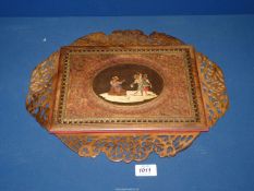 An Olive wood Sorrento ware folder with fold out fret work ends and inlaid musical scene to the