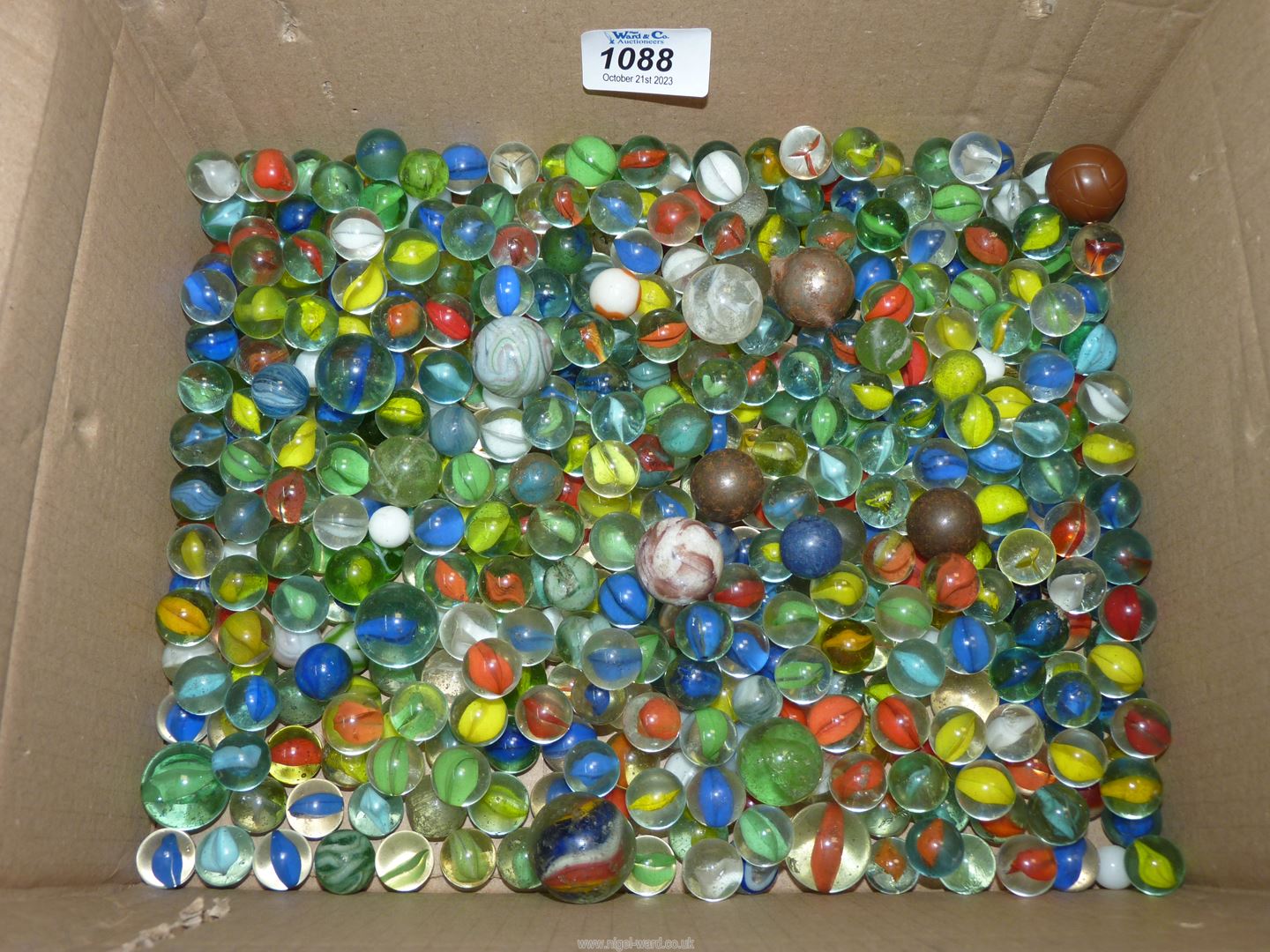 A box of Marbles including large marbled, steel coloured, etc.