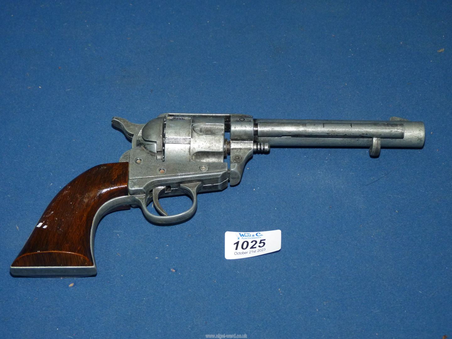 A replica Colt single action Army 45 pistol.