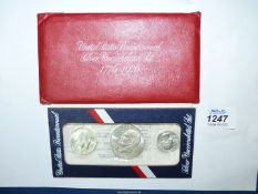 A set of three uncirculated silver United States Bicentennial coins 1776-1976 in presentation