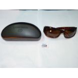 A pair of Gerry Weber sunglasses with case.