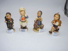 Four Goebel figures to include; Feeding time, boy with ladder, boy with jelly and a boy rambling.