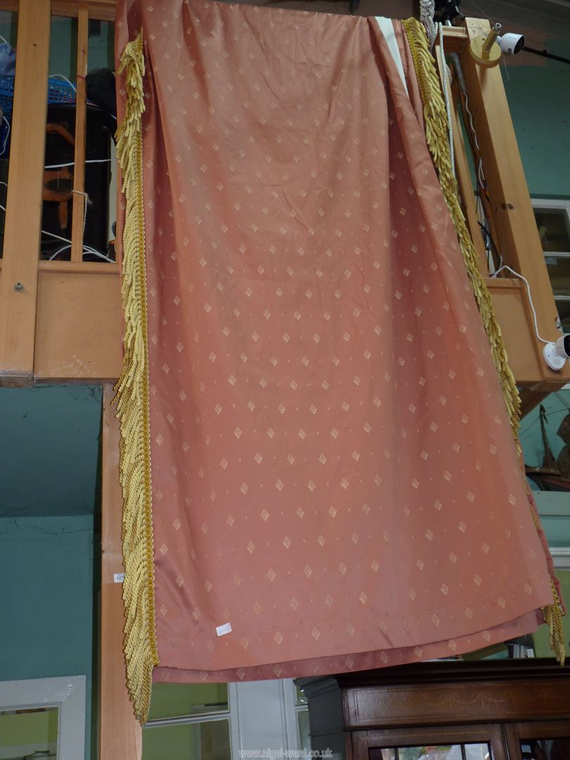 A pair of terracotta curtains having a diamond pattern and gold trim 105" x 50" [ some stains]