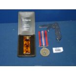 A George VI WWII medal together with a Kingsway Quartz electronic lighter and British Army clasp