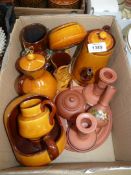 A quantity of mustard and brown Torquay ware including a chamber stick, jug, coffee pot,
