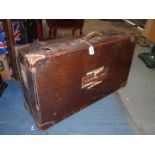 A large early 20th century quality Leather Suitcase with interior shelf and pouch and several old