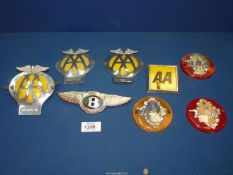 A quantity of car badges to include three BSA, four AA,