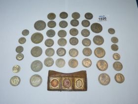 A quantity of coins including half crowns, shillings and sixpences (mainly between 1921 & 1947),