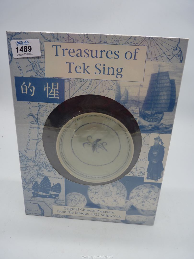 A sealed box containing "Treasures of Tek sing " Chinese porcelain bowl with blue floral motif to