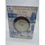 A sealed box containing "Treasures of Tek sing " Chinese porcelain bowl with blue floral motif to